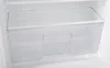 The interior of a refrigerator, showing a clear plastic drawer. Produktbild-Vorschau