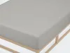 A close-up view of a gray fitted sheet on a wooden bed frame. Produktbild-Vorschau