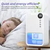 A child sleeping next to a dehumidifier on a bedside table. Produktbild-Vorschau