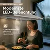 A woman is cooking under a modern kitchen hood with LED lighting. Produktbild-Vorschau