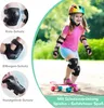 A young girl wearing protective gear and riding a skateboard. Produktbild-Vorschau