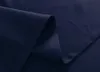 A close-up view of dark blue fabric, showing folds and seams. Produktbild-Vorschau