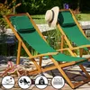 Two green deck chairs with a straw hat on one, set up on a stone patio next to a pond with plants. Anteprima dell’immagine prodotto