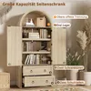 A light wood cabinet with doors and drawers, featuring internal shelves and decorative elements. The image includes callouts and text describing its features. Podgląd zdjęcia produktu