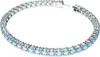 A close-up studio shot of a silver tennis bracelet with blue stones. Voir les images du produit