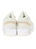 A pair of beige Saucony Grid 9000 trainers shown from the back. Produktbild-Vorschau