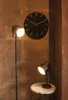 A modern living room with a wall clock and two lamps. Náhled obrázku produktu