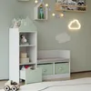 A children's storage bench with a house-shaped bookshelf attached, decorated with toys and lights. Podgląd zdjęcia produktu