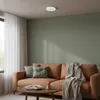 A living room scene with a sofa, coffee table, and a ceiling light. Náhľad obrázku produktu