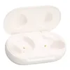 An open white charging case for wireless earbuds, showing the interior compartments for the earbuds and charging contacts. Náhled obrázku produktu
