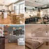 A collage of four different interior design scenes, including a kitchen, a cafe, a living room, and a bedroom. Produktbild-Vorschau
