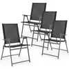 Four black folding chairs are arranged in a group on a white background. Podgląd zdjęcia produktu