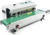 A white industrial sealing machine with a green conveyor belt, shown against a white background. Náhled obrázku produktu