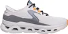 A side view of a white Skechers sneaker with gray and orange accents. Voir les images du produit