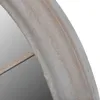 A close-up view of the edge of a rustic garden mirror with an arched frame. Podgląd zdjęcia produktu