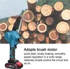 A portable electric chainsaw is shown in front of a pile of cut logs. Podgląd zdjęcia produktu