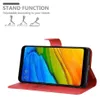 A red phone case is shown open, displaying a smartphone with a colorful wallpaper. The case is designed to function as a stand. Náhled obrázku produktu