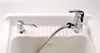 A close-up shot of a sink faucet and soap dispenser set on a white sink. Voir les images du produit