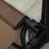 Close-up of a corner of a raised dog bed, showing the fabric and the black plastic frame. Produktbild-Vorschau