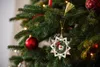 A close-up view of a decorated Christmas tree with ornaments. Náhľad obrázku produktu