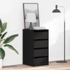 A black drawer cabinet with a lamp and a plant next to it. Anteprima dell’immagine prodotto