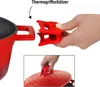 A hand is shown holding red silicone pot handle covers, demonstrating how they attach to a red pot handle and a red pot lid. Voir les images du produit