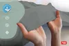 Hands holding a gray fabric, with icons and text overlays. Produktbild-Vorschau