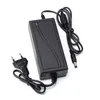A black power adapter with two cables and a European plug, isolated on a white background. Produktbild-Vorschau