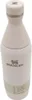 A white Stanley slim bottle with a pinkish hue and a gray lid, set against a white background. Produktbild-Vorschau
