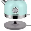 A mint green electric kettle with a silver base and spout, featuring a built-in thermometer. The kettle is shown with its power base. Voir les images du produit