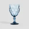 A single blue glass with a diamond pattern on a light gray background. Podgląd zdjęcia produktu