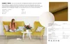 A woman sitting on a yellow sofa in a living room setting with two yellow armchairs and a coffee table. Produktbild-Vorschau
