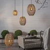 An outdoor patio setting with wicker furniture and decorative lighting. Podgląd zdjęcia produktu