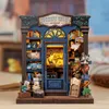 A miniature model of a bookshop with illuminated interior. Náhled obrázku produktu