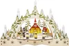 A wooden Christmas decoration with LED candles, depicting a winter village scene with a church and figures. Produktbild-Vorschau