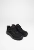 A pair of black hiking shoes with brown accents on a white background. Anteprima dell’immagine prodotto