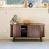 A wooden TV stand with decorative items on top and next to it, placed in a room setting. Anteprima dell’immagine prodotto