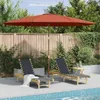 Two lounge chairs and a table are set up next to a swimming pool, under a large umbrella. Voir les images du produit