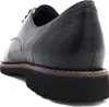 Close-up side view of a black leather shoe. Anteprima dell’immagine prodotto