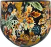 A close-up view of a decorative pot with a floral and leaf pattern. Produktbild-Vorschau