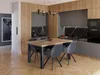 A dining table and chairs set in a modern kitchen/dining area. Produktbild-Vorschau