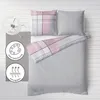A flat lay of bedding on a white wooden floor. Produktbild-Vorschau