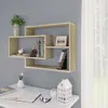 A modern wall shelf unit with books and decorative items is mounted on a gray wall above a white desk with a notebook, glasses, and a decorative house. Produktbild-Vorschau