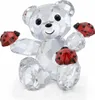 A clear, well-lit studio shot of a crystal teddy bear figurine holding ladybugs. Voir les images du produit