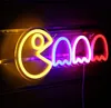 A neon sign shaped like Pac-Man and ghosts. Voir les images du produit