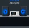 A micro audio system with two speakers, displayed on a dark surface against a dark background. Blue light emanates from the speakers, suggesting sound waves. Produktbild-Vorschau