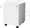 A white roll container with three drawers and wheels, shown with dimensions indicated by measurement lines and text. Náhled obrázku produktu