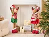 Two festive reindeer decorations are displayed in a home setting near a fireplace and a Christmas tree. Náhľad obrázku produktu