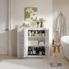 A bathroom cabinet filled with toiletries and towels, next to a bathtub and a bathrobe hanging on a hook. Produktbild-Vorschau