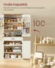 A large white kitchen cabinet with wooden accents, filled with various kitchen items and accessories. The cabinet doors are open, revealing shelves stocked with jars, containers, appliances, and dishes. A small wooden table with more kitchen items is place Produktbild-Vorschau